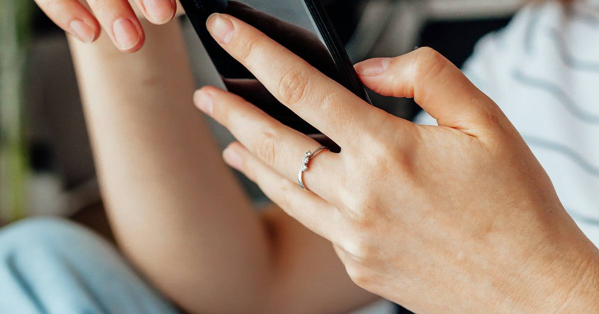 Close-up of hands holding a smartphone